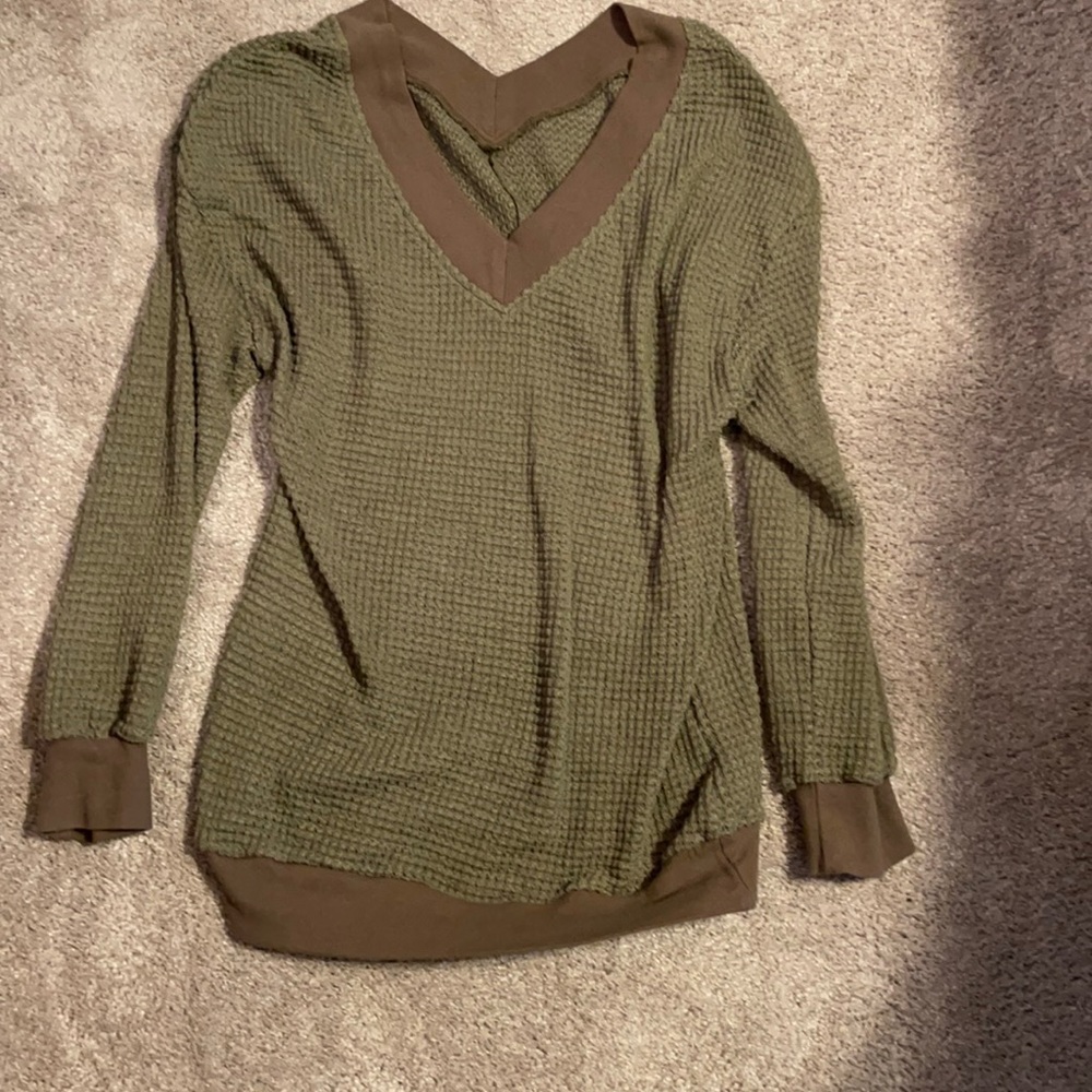 Green V-neck sweater
